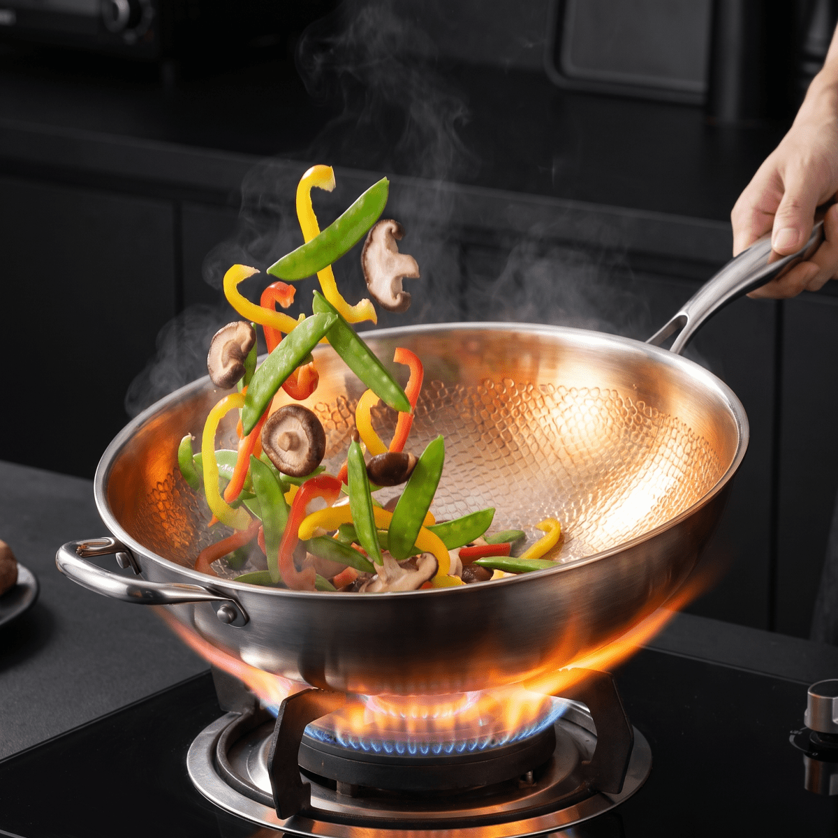 Forged Hammered Stir-Fry Pan cooking on a stovetop