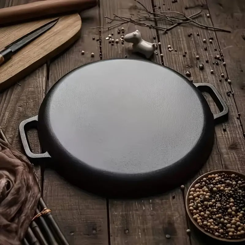 Black cast iron Non-Stick Griddle Pan on wooden table bottom view