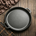 Black cast iron Non-Stick Griddle Pan on wooden table  