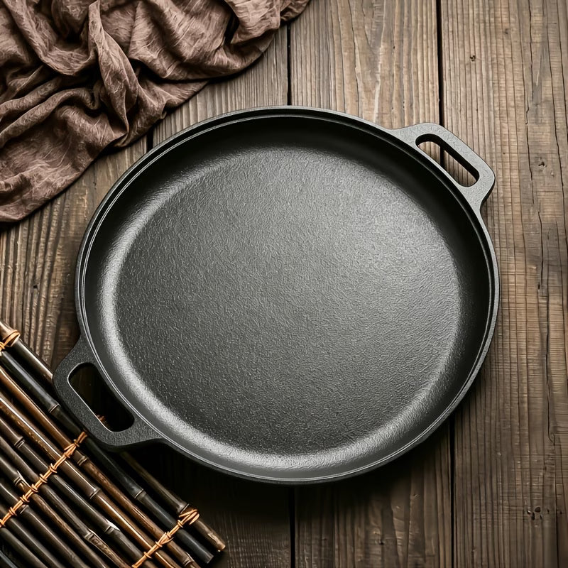 Black cast iron Non-Stick Griddle Pan on wooden table  