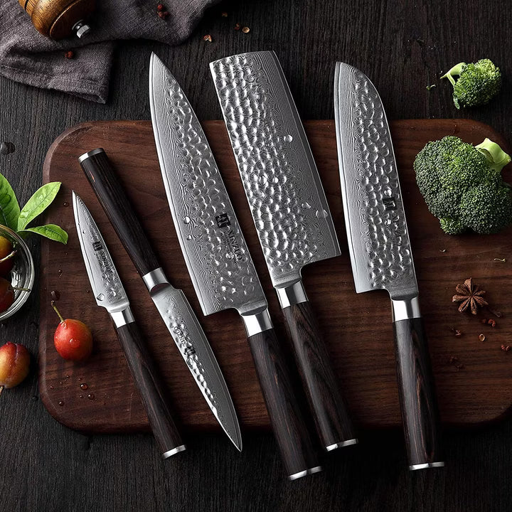 Fenn 5-piece Damascus-pattern knife set displayed on a cutting board