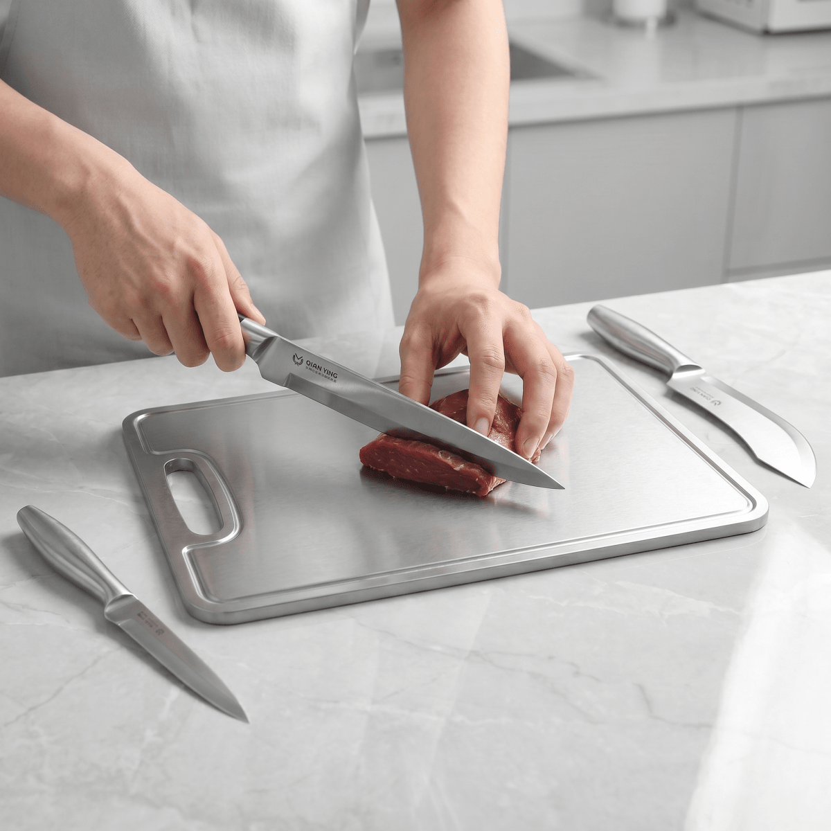 Fenn butcher knife in use, cutting meat