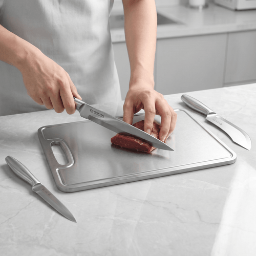 Fenn butcher knife in use, cutting meat