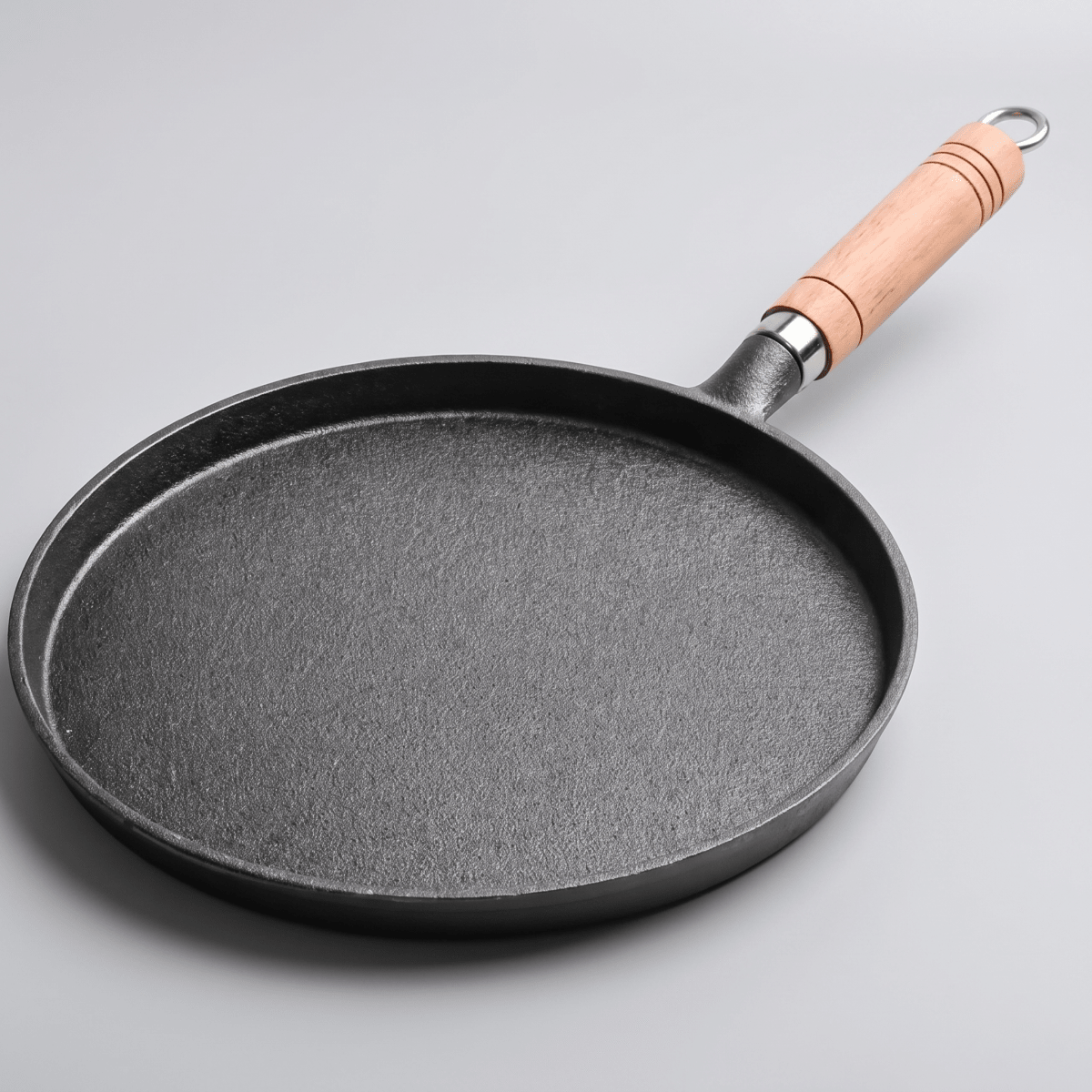 Fenn cast iron pan with wooden handle, studio view