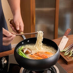 Fenn cast iron pot simmering noodle soup with shrimp and vegetables