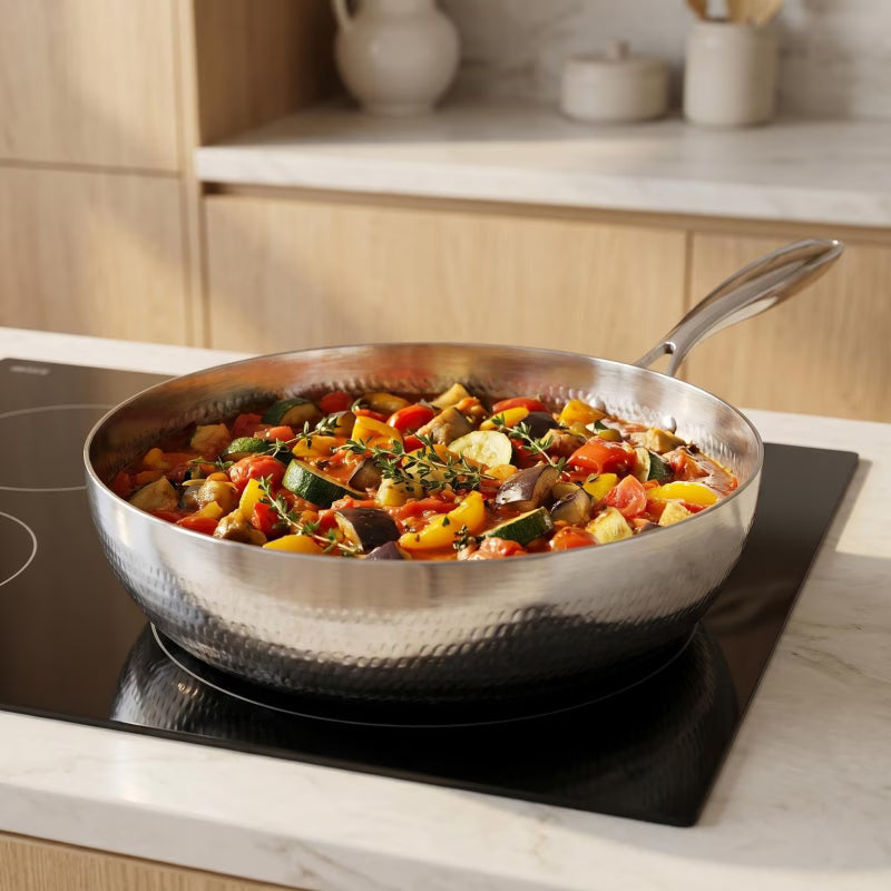 Fenn forged hammered multi-pan braising vegetables on the stovetop