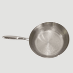 interior-texture-detail.avif	Detail of Fenn forged hammered multi-pan's hand-hammered interior surface and handle