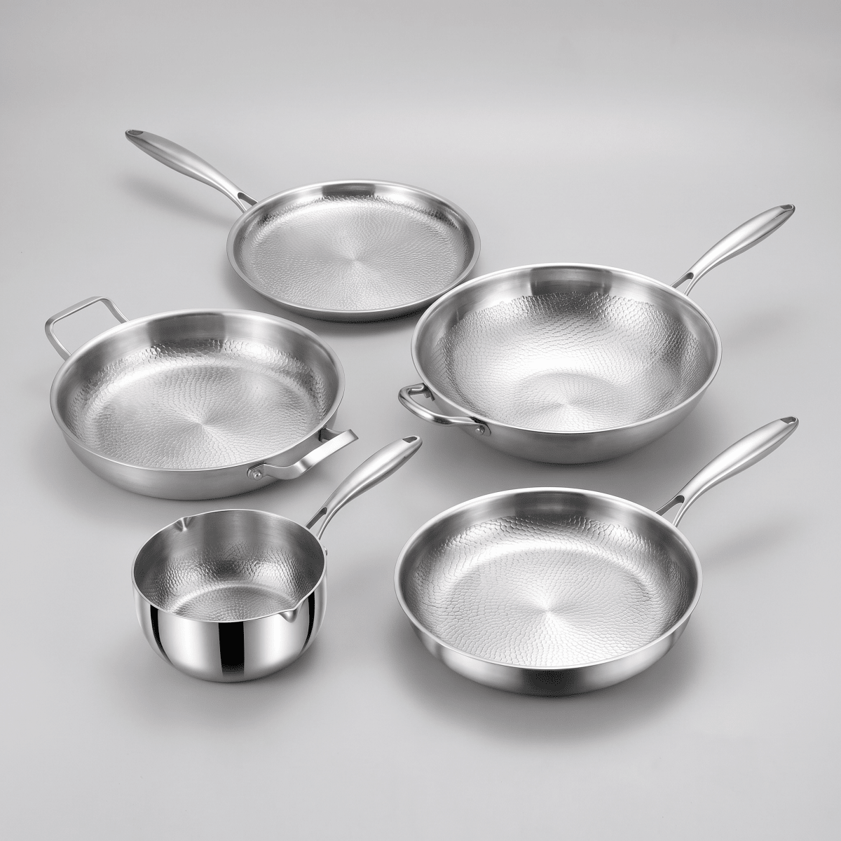 Fenn hammered forged pan collection — frying, stir-fry, dual-handle, high-wall, and griddle pans