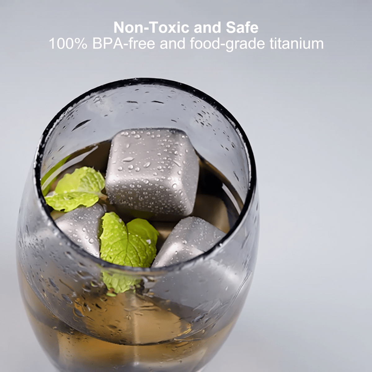 Fenn metal ice cubes chilling a whiskey drink