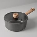 Fenn non-stick saucepan with glass lid and wood handle, angled view