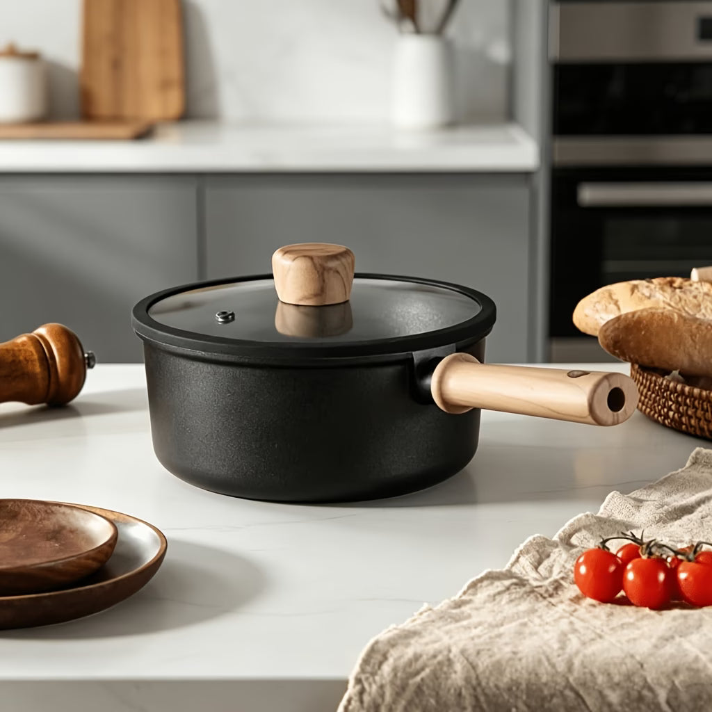 Fenn non-stick saucepan with lid styled on kitchen counter with bread and tomatoes