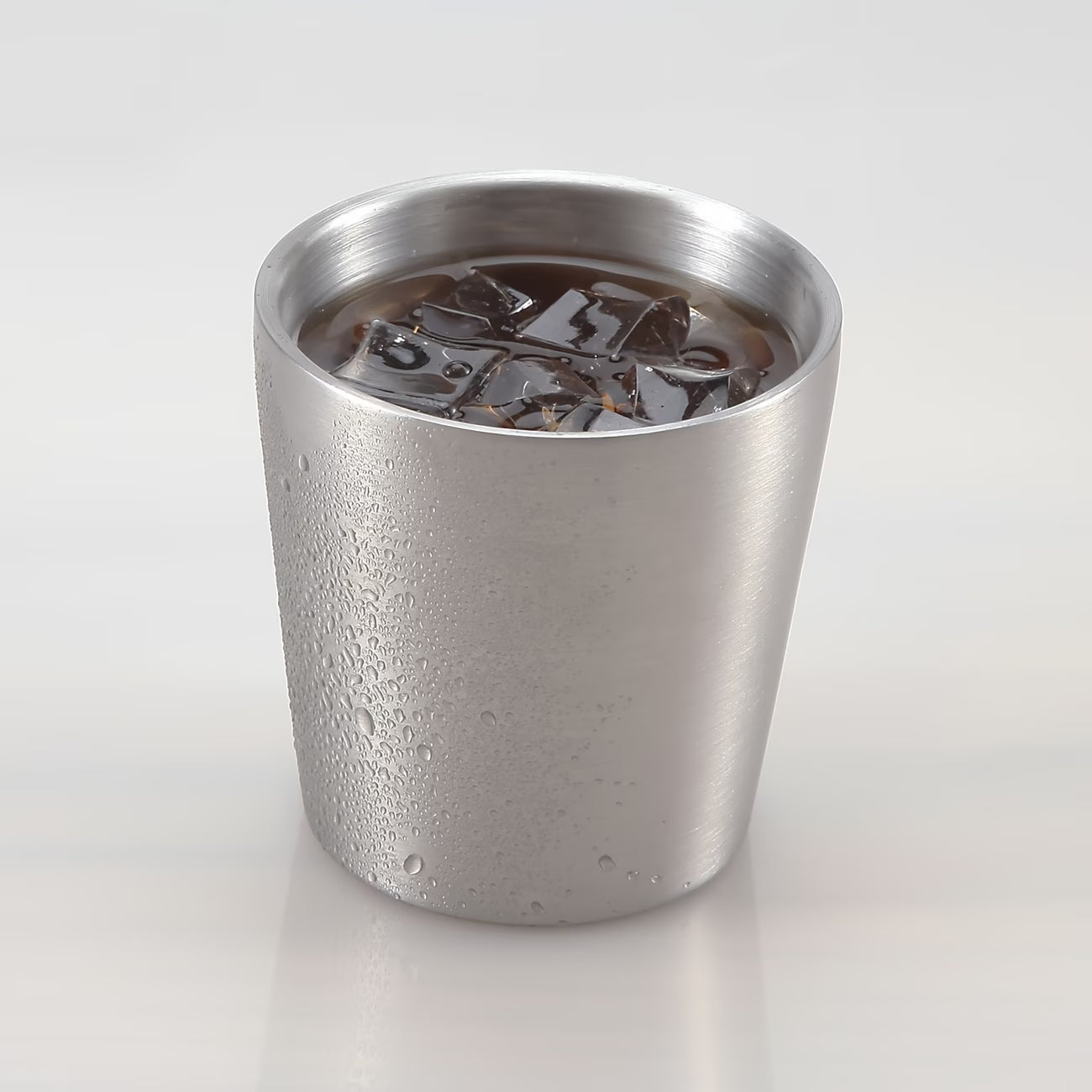 Fenn stainless steel cup filled with an iced drink